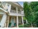 Beautiful home with a covered porch, stone accents, and lush landscaping in a peaceful setting at 2355 Crockett Park Pl, Charlotte, NC 28203