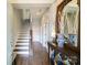 Inviting foyer with hardwood floors, a staircase, and a decorative table creating a warm welcome at 2355 Crockett Park Pl, Charlotte, NC 28203