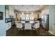 Spacious kitchen featuring central island with bar seating, modern fixtures, and stainless steel appliances at 2355 Crockett Park Pl, Charlotte, NC 28203