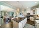 Open-concept kitchen flows into dining and living areas, featuring a large island and modern appliances at 2355 Crockett Park Pl, Charlotte, NC 28203