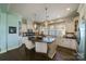 Bright kitchen with stainless steel appliances, a large island, and dark hardwood floors at 2355 Crockett Park Pl, Charlotte, NC 28203
