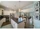 Open kitchen featuring an island with seating, stainless steel appliances, and seamless flow to living areas at 2355 Crockett Park Pl, Charlotte, NC 28203