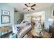 Cozy living room featuring hardwood floors, an open staircase, and seamless access to the kitchen and dining area at 2355 Crockett Park Pl, Charlotte, NC 28203