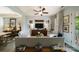 Bright living room with hardwood floors, ceiling fan, and stylish decor, creating an inviting atmosphere at 2355 Crockett Park Pl, Charlotte, NC 28203