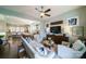 Open-concept living area with hardwood floors and ample seating, perfect for entertaining guests at 2355 Crockett Park Pl, Charlotte, NC 28203
