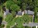 Aerial view showcasing the property's location surrounded by lush greenery and mature trees in a neighborhood setting at 2601 Pinewood Rd, Gastonia, NC 28054