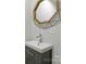 Bathroom featuring a sleek sink with modern fixtures and a decorative mirror, enhancing the vanity area's appeal at 2601 Pinewood Rd, Gastonia, NC 28054