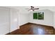 Charming bedroom featuring hardwood floors, a ceiling fan, a window and closet space at 2601 Pinewood Rd, Gastonia, NC 28054