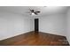 Bedroom with hardwood floors, a ceiling fan, and a closet that provides a cozy and functional living space at 2601 Pinewood Rd, Gastonia, NC 28054