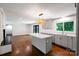 Spacious open floorplan featuring gray cabinets, stainless appliances, island, and a brick fireplace at 2601 Pinewood Rd, Gastonia, NC 28054