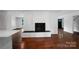 Brick fireplace in the living room and view into other living spaces at 2601 Pinewood Rd, Gastonia, NC 28054
