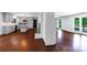 Open living area with hardwood floors, an island, a fireplace and plenty of natural light, seamlessly connecting spaces at 2601 Pinewood Rd, Gastonia, NC 28054