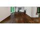 Spacious living room with hardwood floors and a fireplace, offering a versatile area for relaxation and entertaining at 2601 Pinewood Rd, Gastonia, NC 28054