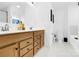 Well-lit bathroom features a double vanity, sleek fixtures, and ample counter space at 3153 Pinehills Way, Mount Holly, NC 28120