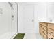 Bathroom featuring a modern glass-enclosed shower, wood vanity, and stylish design at 3153 Pinehills Way, Mount Holly, NC 28120