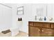 Well-lit bathroom featuring vanity with storage and a toilet with shower, combining convenience and functionality at 3153 Pinehills Way, Mount Holly, NC 28120