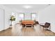 Bright bedroom with hardwood floors, neutral walls, and natural light from multiple windows at 3153 Pinehills Way, Mount Holly, NC 28120