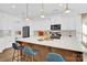 Stylish kitchen featuring a large island with seating and modern light fixtures at 3153 Pinehills Way, Mount Holly, NC 28120