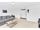 Inviting living room with neutral carpet, comfortable couch, and bright lighting, creating a relaxing atmosphere at 3153 Pinehills Way, Mount Holly, NC 28120