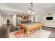 Spacious basement featuring a pool table, kitchenette, workstation, and sitting area at 3306 Delamere Dr, Matthews, NC 28104