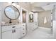 Bright bathroom featuring double vanities with granite countertops at 3306 Delamere Dr, Matthews, NC 28104