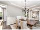 Elegant dining room with a wooden table, stylish chairs, and decorative chandelier at 3306 Delamere Dr, Matthews, NC 28104