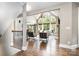 Bright living room with large windows, hardwood floors, stone fireplace and open floor plan at 3306 Delamere Dr, Matthews, NC 28104
