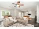 Inviting living room featuring a billiards table, comfortable seating, and a ceiling fan at 3306 Delamere Dr, Matthews, NC 28104