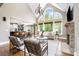 Bright living room with vaulted ceilings, large windows, stone fireplace, and hardwood floors at 3306 Delamere Dr, Matthews, NC 28104