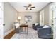 Office space with grey walls, dark wood desk, light rug, and french door at 3306 Delamere Dr, Matthews, NC 28104