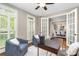Cozy office space featuring hardwood floors, french doors, shutters, and natural light at 3306 Delamere Dr, Matthews, NC 28104