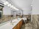 Primary bathroom featuring dual vanities, a soaking tub, and tile flooring at 3546 Mount Pleasant N Rd, Concord, NC 28025