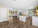 Modern kitchen boasts white cabinets, stainless steel appliances, butcher block island, and open floor plan at 3546 Mount Pleasant N Rd, Concord, NC 28025