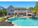 Gorgeous backyard featuring a sparkling pool, well-maintained landscaping, and multiple seating areas at 4160 Isle Of Pines Dr, Denver, NC 28037