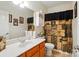 Bathroom featuring wood vanity and neutral-colored shower curtain at 4160 Isle Of Pines Dr, Denver, NC 28037