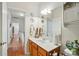 Bathroom featuring wood vanity and view into hallway at 4160 Isle Of Pines Dr, Denver, NC 28037