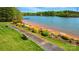 Scenic view of the beach with picnic benches and well maintained landscape at 4160 Isle Of Pines Dr, Denver, NC 28037