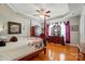 Spacious bedroom with tray ceiling, hardwood floors, and elegant decor at 4160 Isle Of Pines Dr, Denver, NC 28037