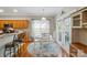 Bright breakfast nook with a round table, white chairs, and a view of the backyard, perfect for enjoying a morning meal at 4160 Isle Of Pines Dr, Denver, NC 28037