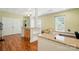 Well-lit flex space with granite countertops, custom built-ins, and laminate flooring at 4160 Isle Of Pines Dr, Denver, NC 28037