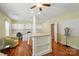Versatile flex space with a large island, custom built-ins, and laminate flooring at 4160 Isle Of Pines Dr, Denver, NC 28037
