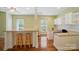 Large flex space featuring granite countertops, built-in storage, and laminate flooring at 4160 Isle Of Pines Dr, Denver, NC 28037