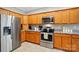 Well-lit kitchen featuring stainless steel appliances, granite countertops, and light wood cabinetry at 4160 Isle Of Pines Dr, Denver, NC 28037