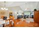 Inviting living room with hardwood floors, vaulted ceilings, a cozy fireplace, and abundant natural light at 4160 Isle Of Pines Dr, Denver, NC 28037