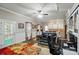 Spacious living room with a colorful rug, ceiling fan, and adjacent kitchenette space at 4160 Isle Of Pines Dr, Denver, NC 28037