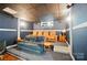Cozy movie room featuring tiered seating, plush sofas, and recessed lighting at 4160 Isle Of Pines Dr, Denver, NC 28037