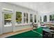 Bright sunroom with views of the pool, wicker furniture, and natural light at 4160 Isle Of Pines Dr, Denver, NC 28037