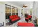 Bright sunroom features large windows and a ceiling fan, ideal for a relaxing seating area at 4160 Isle Of Pines Dr, Denver, NC 28037