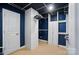 Walk-in closet with ample shelving, hanging rods, and a neutral carpet at 4160 Isle Of Pines Dr, Denver, NC 28037