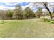 Lush green backyard with direct water access provides a private, scenic setting for outdoor enjoyment at 455 W Gleneagles Rd, Statesville, NC 28625